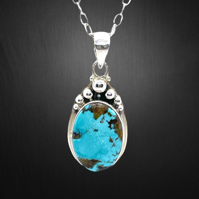 Turquoise Silver Pendant Necklace with matching chain.