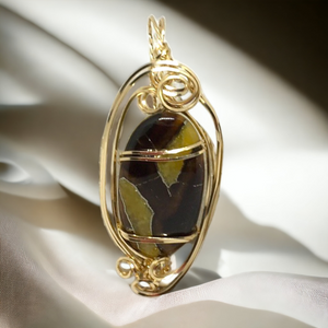 Amber Simbircite Wire Wrapped Pendant In 14 kt Gold