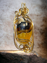 Amber Simbircite Pendant 14 kt Gold Wire Wrapped Pendant In Sculpted Gold