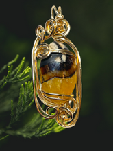 Amber Simbircite Pendant 14 kt Gold Wire Wrapped Pendant In Sculpted Gold